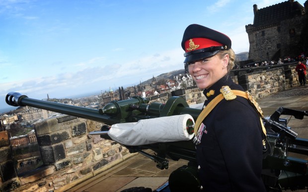 Captain Lori Sharp, the first ever commissioned officer, to fire the world famous One o'clock Gun, to celebrate International Women's Day. [Picture: Crown Copyright]