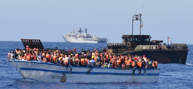 Pictured: 369 migrants crammed into a heavily overcrowded wooden hulled boat which was located in the waters just north of Libya.  They were led to safety from their stricken boat to Landing craft from HMS Bulwark. The Fleet Flagship has once again played a leading role today [28 May] in an international rescue of hundreds of migrants from their stricken craft in the Central Mediterranean. This afternoon HMS BULWARK recovered 369 migrants crammed into the heavily overcrowded wooden hulled boat which was located in the waters just north of Libya. The ship dispatched 5 of its landing craft to rescue the migrants from their unstable double-decker craft, 50 of whom were small children. All 8 of BULWARKs specialist landing craft have been converted into rescue boats, loaded with lifejackets, medical facilities and emergency supplies for this search and rescue mission  codenamed Operation WEALD.  A total of 5 Safety of Life at Sea or SOLAS incidents have been conducted concurrently today by UK, Italian, German and Irish naval units operating together in the area.