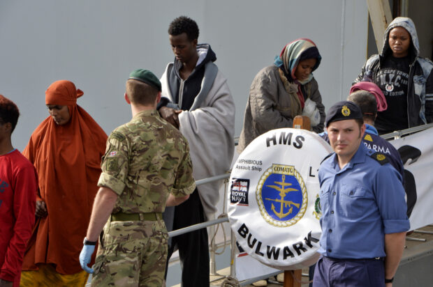 Migrants safely disembarking in Sicily from HMS Bulwark, yesterday 14 May 2015.