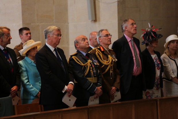 Defence Secretary Michael Fallon at the Armed Forces Day service at Guildford Cathedral today. Today, thousands of people across the country celebrated the men and women of the Armed Forces, past and present, at more than 150 events to mark the seventh annual Armed Forces Day.  Events ranged from large scale parades to simple community events, but the main focus of attention was at the National Event in Guildford, attended by His Royal Highnesses The Duke of York and the Prime Minister David Cameron. The Secretary of State for Defence Michael Fallon and the Worshipful Mayor of Guildford Nikki Nelson-Smith also attended.   The days celebrations began with a thanksgiving service at Guildford Cathedral, followed by a parade of more than 900 Service personnel, veterans and cadets through the historic heart of Guildford from the High Street to the outdoor events arena, Stoke Park.  The Duke of York took the salute on the parade route on behalf of The Queen and Royal Family, as the world famous Red Arrows roared over the square in tribute. Afternoon celebrations continued Stoke Park with a variety of military displays including a Royal Air Force GR4 Tornado flypast. Visitors also enjoyed a Sea King search and rescue demonstration, Spitfires and Hurricaines from the RAF Battle of Britain memorial Flight and a Swordfish biplane from the Royal Navy Historic Flight.   In addition, crowds of an estimated 60,000 were treated to three parachute displays from the Royal Navy Raiders, the Army Red Devils and the RAF Falcons, as well as the Royal Signals White Helmet motorbike display team on the ground.  The Red Arrows took to the skies again as the military celebrations drew to a close accompanied by a tri-service group of military bands made of Her Majestys Royal Marines, Portsmouth, the Band of the Grenadier Guards, and the Central Band of the Royal Air Force.
