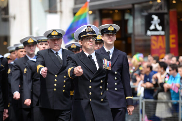 The Royal Navy contingent march through London during the London Community Pride parade. Armed Forces March in London Pride 270615 The Armed Forces marched through the streets of London today on Armed Forces Day as part of the London Community Pride parade. Prior to the event participants met with the Minister of the Armed Forces Penny Mordaunt MP and the Minister for Equalities Incumbent Caroline Dinenage MP as well as a number of Senior Military Officers at the Hyatt Regency Hotel in London. Image taken by LA(Phot) Simmo Simpson, FRPU(E), Royal Navy. Consent forms where required held by FRPU(E), HMS Excellent.