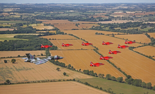 19 July: TWO icons of British aviation, the Red Arrows and Vulcan bomber, have performed a joint flypast for the last time at the Royal International Air Tattoo Jets from the Royal Air Force Aerobatic Team met with the distinctive Cold War aircraft over the skies of Gloucestershire to mark the Vulcan's final flying season. The Vulcan, XH558, is the last airworthy example of the UK's famous V-Force fleet and the delta-winged aircraft will not take to the skies again after 2015. To salute the remarkable former RAF bomber, the Red Arrows performed a flypast with the Vulcan in front of tens of thousands of people at the Royal International Air Tattoo, at RAF Fairford.