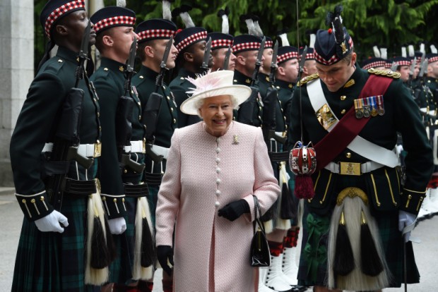 Her Majesty the Queen inspects her Royal Guard made up of soldiers from The Royal Highland Fusiliers, 2nd Battalion The Royal Regiment of Scotland (2 SCOTS) at the gates of Balmoral Castle to mark the official start of her summer holidays on Deeside.