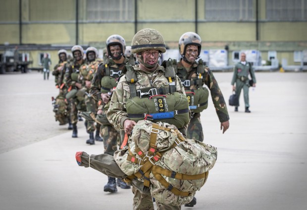 Members of 2 Squadron RAF Regiment based at RAF Honnington and their Indian counterparts walk out to a RAF C130 aircraft at RAF Brize Norton before jumping onto Stanta range as part of Exercise Indra Dhanush 2015.