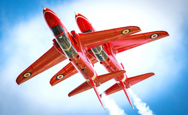 The Royal Air Force aerobatic team, The Red Arrows perform a number of manouveres during their display. One of which, is the synchro pair flying inverted in close formation to one another, with just a few feet between each aircraft. Here, the duo are seen rehearsing for the 2015 Royal International Air Tattoo.