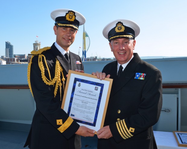 In his role as Commodore-in-Chief RFA His Royal Highness The Earl of Wessex presented seven medals onboard RFA Argus following an earlier presentation to Royal Navy medical personnel by the First Sea Lord Sir George Zambellas. HRH also presented four Long Service and Good Conduct clasps for 30 years service to personnel who have shown exemplary behaviour - including one for the Commodore RFA Cdre Rob Dorey. Personnel on board RFA Argus have been awarded Ebola campaign medals following a six-month deployment to West Africa. The Royal Fleet Auxiliary ship deployed to Sierra Leone in October 2014 with more than 350 Tri-Service personnel on board - and returned to Falmouth in April this year. The Earl of Wessex then had a tour of the RFA and was able to meet many members of the Ship's Company. Pictured: Commanding Officer RFA Argus Captain David Eagles accepts the James Coull Memorial Award on behalf of the whole ships company in recognition of their work in the international Ebola relief effort. LA(PHOT) Keith Morgan