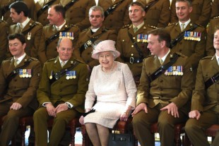 Her Majesty The Queen joins officer from The Royal Scots Dragoon Guards for an official photo at their new base in Leuchars Station Fife.