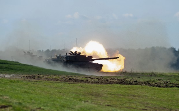 A Challenger 2 tank fires live rounds on to the target at the Land Warfare Centre in Warminster where more than 30 bosses from medium-sized companies attended the Understanding the Army Reserve Land Combat Power Visit this week