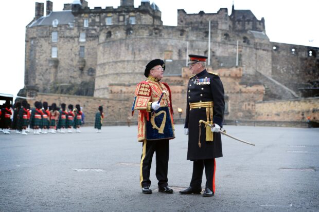 The latest Governor of Edinburgh Castle, Major General Mike Riddell-Webster, chats to Lord Lyon Dr Joseph Morrow on the esplanade of the world famous monument. General Riddell-Webster, a former Regular Army Officer, is the firs member of the Army Reserves to hold the appointment. The Lord Lyon, King of Arms presides over this ancient and historic ceremony. 