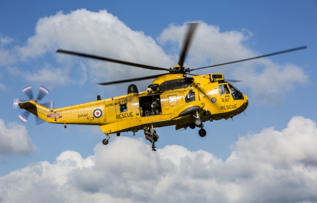 Images Shows: The RAF's famous yellow Sea King Search and Recue(SAR) Helicopters at RAF Chivenor, Devon on the 13th October 2015. Tthe RAF's famous yellow Sea King Helicopters will no longer be a familiar sight in Britian's skies following the handover of Search and Rescue(SAR) duties to a private company. RAF Chivenor in Devon was the last SAR base to hand over responsibility to Bristow Helicopters Ltd. While RAF SAR missions in the UK have come to an end, a small number of Sea King crews will continue to train at Chivenor to prepare them to provide cover for Aircrew stationed in the Falkland Islands. Images By Sgt Neil Bryden RAF