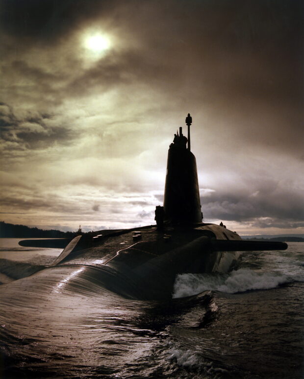 This Trident Submarine is a Nuclear powered vessel contributing to NATO's nuclear deterrent. It is an advanced, high speed, long endurance underwater sub. These displace over 16 thousand tonnes and offer spacious accommodation on three decks. These carry up to 16 missiles each carrying 12 warheads. Crown Copyright.