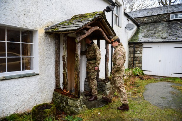 Soldiers from 2 LANCS speak to locals affected by the floods