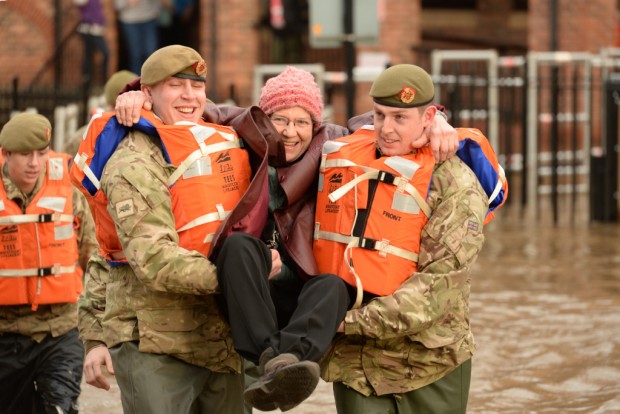 Photographer - SSgt Mark Nesbit RLC (Army Photographer) - Army Headquarters British Army assist the Environment Agency with floods. The lighter side, as a local resident is rescued from their flat by members of 2 LANCS. As unprecedented flooding spreads out over the North of England, the British Army are assisting the Environment agency. With the flooding spreading further East in York and the surrounding areas and river levels, soldiers from 2LANCS (2nd Battalion the Lancashire Regiment), the duty 'standby' battalion, went door to door in vulnerable areas of York to warn residents to remain vigilant. The City of York is divided today as massive floods have effectively split the city in two. ENDS NOTE TO DESKS: MoD release authorised handout images. All images remain crown copyright. Photo credit to read - Staff Sergeant Mark Nesbit RLC (Phot) richardwatt@mediaops.army.mod.uk shanewilkinson@mediaops.army.mod.uk Richard Watt - 07836 515306 Shane Wilkinson - 07901 590723