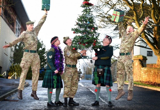 Photo Caption:- 'On the road to Christmas!' Soldiers and Officers of 2 SCOTS based in Penicuik move a Christmas tree for the festive party. Soldiers from The Royal Highland Fusiliers, 2nd Battalion The Royal Regiment of Scotland (2 SCOTS) will return from Operations in Kabul this week following a four month deployment in support of NATOs mission in Afghanistan. The troops deployed to Afghanistan in July 2015 to enhance Kabuls Security Forces and assist in providing security to UK and NATO personnel in the city. Lieutenant Colonel Graeme Wearmouth, Commanding Officer of 2 SCOTS said: As the soldiers of A and B Company 2 SCOTS return to Glencorse Barracks in Penicuik they can reflect on an excellent tour of duty in Kabul. They have upheld the highest standards of Scottish soldiers and enhanced the reputation of The Royal Regiment of Scotland amongst our NATO allies and Afghan partners. On every day during the deployment they have protected NATO advisors throughout Kabul. We have been tested, including by hostile action from insurgents. The Jocks have come through strongly  with professionalism and good humour in equal measure. It has been hugely rewarding to see so many young soldiers develop, mature and grow as professionals. It is very rewarding to see their satisfaction in delivering security in a challenging operating environment. As we in the rest of the Battalion continue the mission in Kabul with two new Companies, themselves fresh and eager to contribute to the NATO mission in Afghanistan at this important time, I would like to wish those returning home a well-deserved happy Christmas with their families and a restful New Year after a job well done. We all look forward to the Battalions eventual reunion in Scotland later in 2016. The mission - which is split into two tours of four months - is part of the UKs enduring commitment to Afghanistan and to provide the country with the best training to allow the Governme