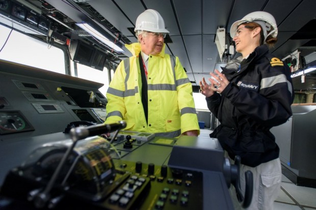 Defence Secretary Michael Fallon with Deputy Navigator Lt Rachel Campbell on the bridge of HMS Queen Elizabeth during his visit to Rosyth, in Scotland
