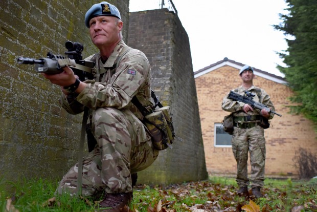 Pictured are two members of the Military Provost Guard Service (MPGS) on patrol at the Army Aviation Centre at Middle Wallop. The Military Provost Guard Service (MPGS) provides professional soldiers to meet armed security requirements at Royal Navy, Army, RAF and other MOD bases in Great Britain. Stationed at over 106 sites, the MPGS have their own Military Local Service Contract which allows soldiers to choose where they wish to serve, providing there is a vacancy. The primary role of the MPGS is to counter the terrorist threat posed to military bases in Great Britain through the provision of armed guarding services. The MPGS is part of the Provost Branch of the Adjutant General's Corps and is under the direction of Provost Marshal (Army), who is the Director and Head of Service. MPGS units are formed under the command of their respective Head of Establishment, with Provost Marshal (Army) maintaining technical standards through annual inspections.