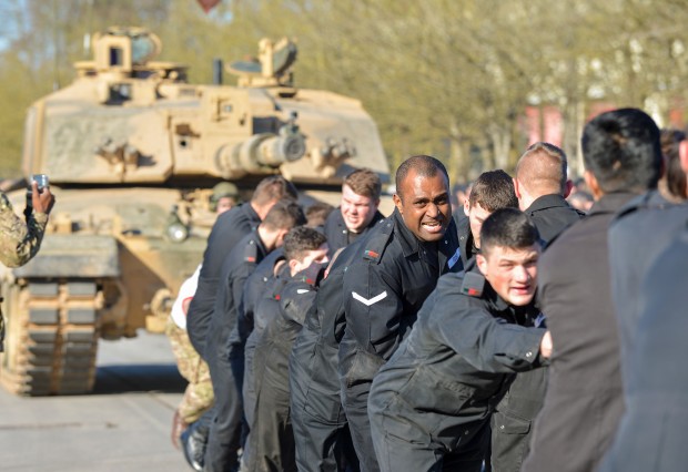 Pictured: The strain shows on the faces of the RTR soldiers as they pull over 60 tonnes of tank over a world record distance. Wiltshire based Royal Tank Regiment (RTR) attempted to pull their way into the Guinness World Record books as the first Regiment to successful pull a Challenger 2 main battle tank on Wednesday 3 February 2016. On 15 September 1916 the first Mark 1 tank rolled across the battlefield at 3.7 miles per hour during the Battle of the Somme, the first offensive using a tank. Almost one hundred years later, 60 soldiers from the RTR took up the strain and, matching the speed of that first tank, pulled the Challenger 2 tank 100 metres. TThe preparation for pulling the 62,500kg Challenger 2 began with a gentle warm up. The RTR soldiers pulled an 8070kg Scimitar armoured reconnaissance vehicle 100 metres, before the star attraction was rolled into position and the RTR began their record setting attempt. Photographer - Cpl Daniel Wiepen RLC (Army Photographer) - Army Headquarters NOTE TO DESKS: MoD release authorised handout images. All images remain Crown Copyright. Photo credit to read - Cpl Daniel Wiepen RLC (Phot) richardwatt@mediaops.army.mod.uk shanewilkinson@mediaops.army.mod.uk Richard Watt - 07836 515306 Shane Wilkinson - 07901 590723