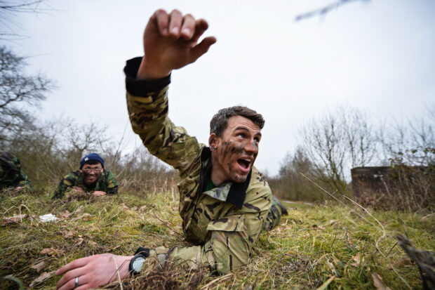 Photo: Cpl Paul Shaw ABIPP; Crown Copyright Matthew Batham throws a mock grenade at a target after crawling through cover and into position. RESERVE CHALLENGE TO TEST CIVILIANS METTLE Exercise Reserve Challenge gives employers the chance to send their personnel on a developmental exercise which focuses on teamwork, leadership and management skills. It also offers the employees a chance to sample life in the Army Reserve. Around 50 staff from Mouchel and Job Seekers from around the Midlands have signed up for the demanding course at Nesscliffe Army Training Area. ENDS NOTE TO DESKS: Pic Ed - richard.watt@mediaops.army.mod.uk 01264 382352 - 94391 2352 07836 515306 Dep Pic Ed - shane.wilkinson@mediaops.army.mod.uk 01264 382351 - 94391 2351 07901 590723 Phot - Cpl Paul Shaw ABIPP paulshaw@mediaops.army.mod.uk 01952 673695 - 94480 3695