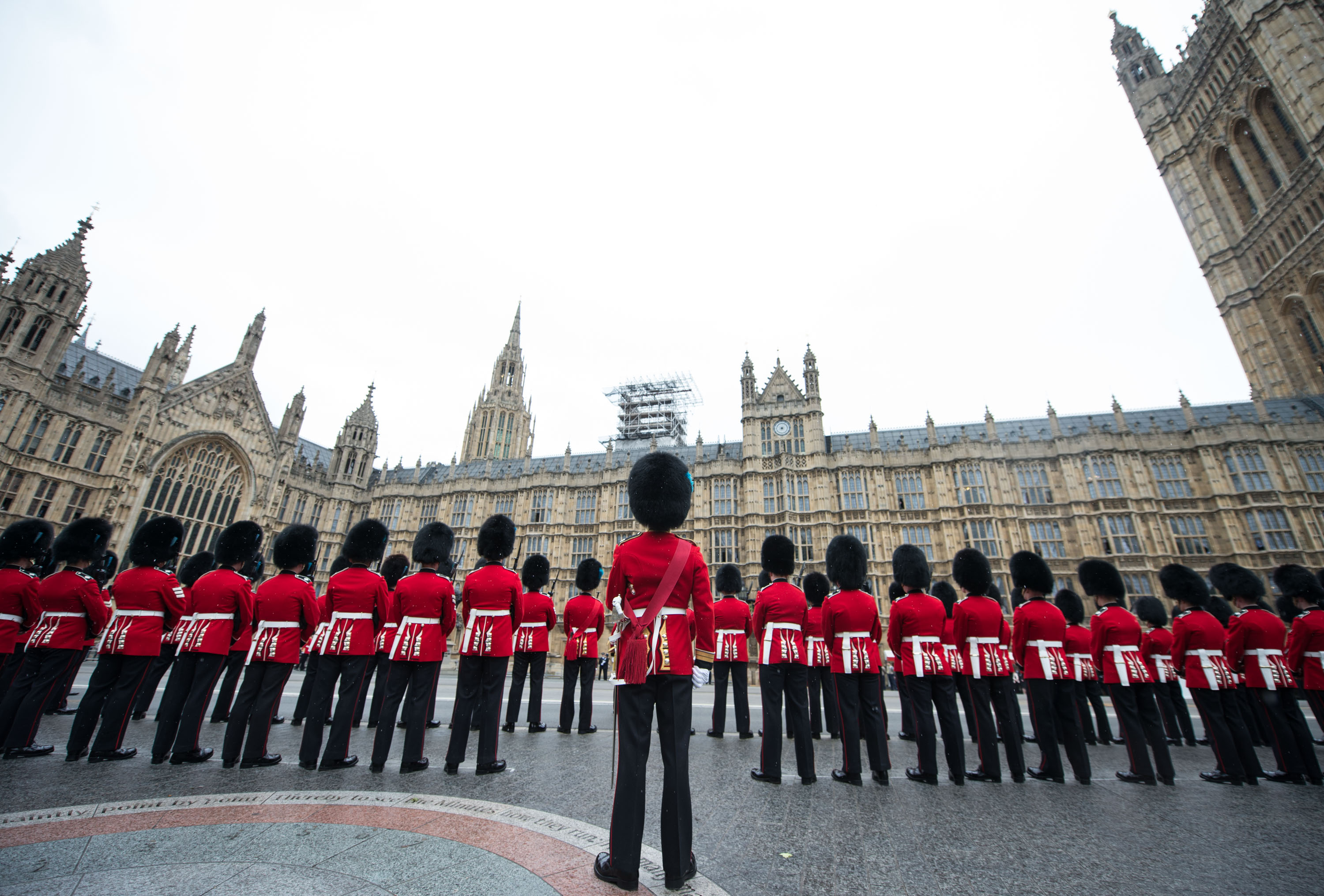 1st Battalion Irish Guards provided a large Guard of Honour at the House of Lords commanded by Lt Col Ian Turner DSO, and accompanied by the Band of the Regiment and the Corps of Drums of the Battalion. The armed forces played a major role in the pomp and ceremony that is part of the State Opening of Parliament, which took place today. In all, 1308 members of the Armed Forces and 217 horses were on public show in a variety of ceremonial roles. The State Opening of Parliament is one of the most colourful events in the London Ceremonial calendar when all elements of the Army’s Household Division, and other elements of the Armed Forces, line the streets and escort Her Majesty The Queen’s procession from Buckingham Palace to the House of Lords. The State Opening marks the formal start of the next parliamentary session. The primary purpose of this colourful tradition is to set out the government's legislative agenda to both Houses of Parliament in the Queen's Speech. Military units taking part this year were The King’s Troop Royal Horse Artillery, the Household Cavalry Mounted Regiment, 1st Battalion Irish Guards, Nijmegen Company Grenadier Guards, Number 7 Company Coldstream Guards, F Company Scots Guards, 1st Battalion Coldstream Guards, Honourable Artillery Company, the Royal Air Force, the Royal Navy, The Royal Artillery Band, Band of the Grenadier Guards, Band of the Coldstream Guards, Band of the Scots Guards, Band of the Irish Guards, Band of the Welsh Guards, with 10 Signal Regiment in support. The Processional Route was by way of The Mall, Horse Guards Road, on to Horse Guards Parade Square, along Whitehall ending at Parliament Street.