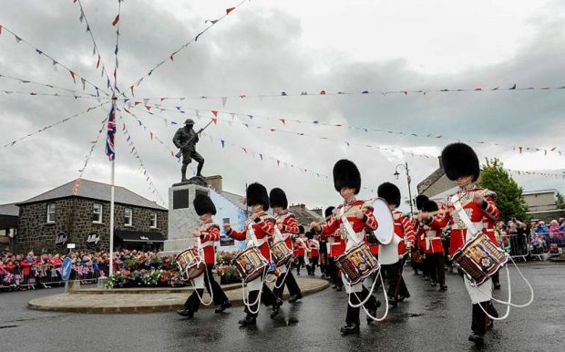 Her Majesty the Queen and the Duke of Edinburgh have visited Northern Ireland on the 28th June 2016, visiting parts of counties Antrim and Londonderry on their two day visit. Their Royal Highnesses have travelled to Northern Ireland’s scenic north coast for a full day of public engagements, including a tour of World Heritage site the Giant’s Causeway stones and also visit nearby Bushmills. Their Royal Highnesses have unveiled a statue to local Victoria Cross winner Robert Quigg whilst visiting the town of Bushmills. On parade were, The Irish Guards as the guard of honour, the band of the Irish Pipes and Drums and the Irish Guards Mascot. The visit to Northern Ireland is part of the Sovereign’s 90th birthday celebrations. Crown Copyright