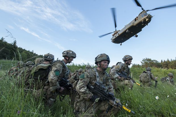 Troops from 3 PARA and 11e Brigade Parachutiste waiting at the Landing Zone for extraction by the Chinook Helicopter of 18 Squadron while training alongside NATO counterparts to develop their ability to work together to deliver a Swift Response to international crises. Crown Copyright.