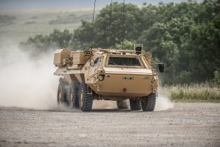 One of the Army’s fleet of FUCHS reconnaissance vehicles being put through its paces by Falcon Squadron Royal Tank Regiment. Crown Copyright.