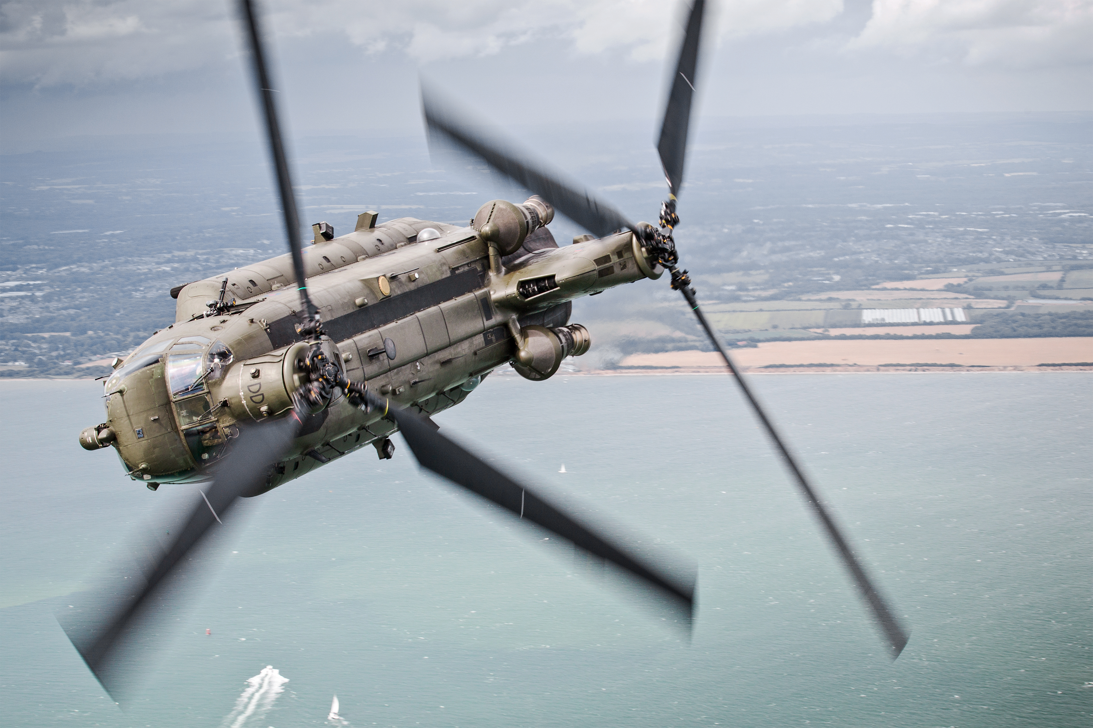 Pictured: A 27 Sqn Chinook makes a hard bank over The Solent during a Aircraft Handling Exercise to assess the development of new Pilots and Aircrew.