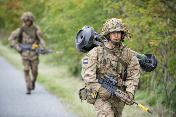 Men from 3 PWRR patrolling back to a safe location to be picked up by vehicle transport.