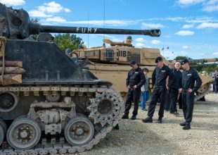 Royal Tank Regiment soldiers admire the tank used in the film 'Fury'. 