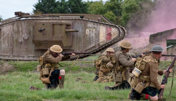 World War 1 re-enactors perform a re-enactment of a battle before and after the invention of the Mk1 tank.