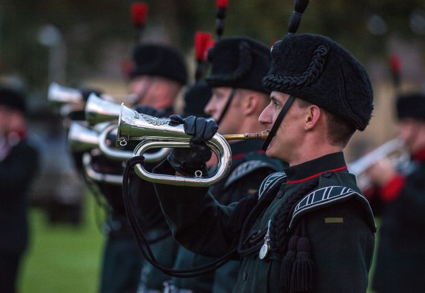 Pictured: Buglers help to bring the performance to a close.