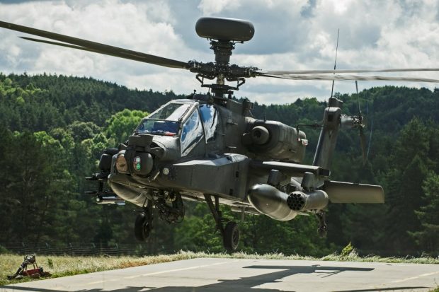 Apache Attack Helicopter from 4 Regiment Air Air Corps taking off for mission tasking over Hohenfels Training Area. British airborne forces trained alongside NATO counterparts earlier this year to develop their ability to work together to deliver a Swift Response to international crises. Crown Copyright.