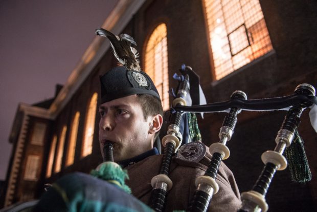 A London Scottish Piper plays as guests arrived at the Carols by Candlelight at Carol Service in The Royal Hospital Chelsea. 
