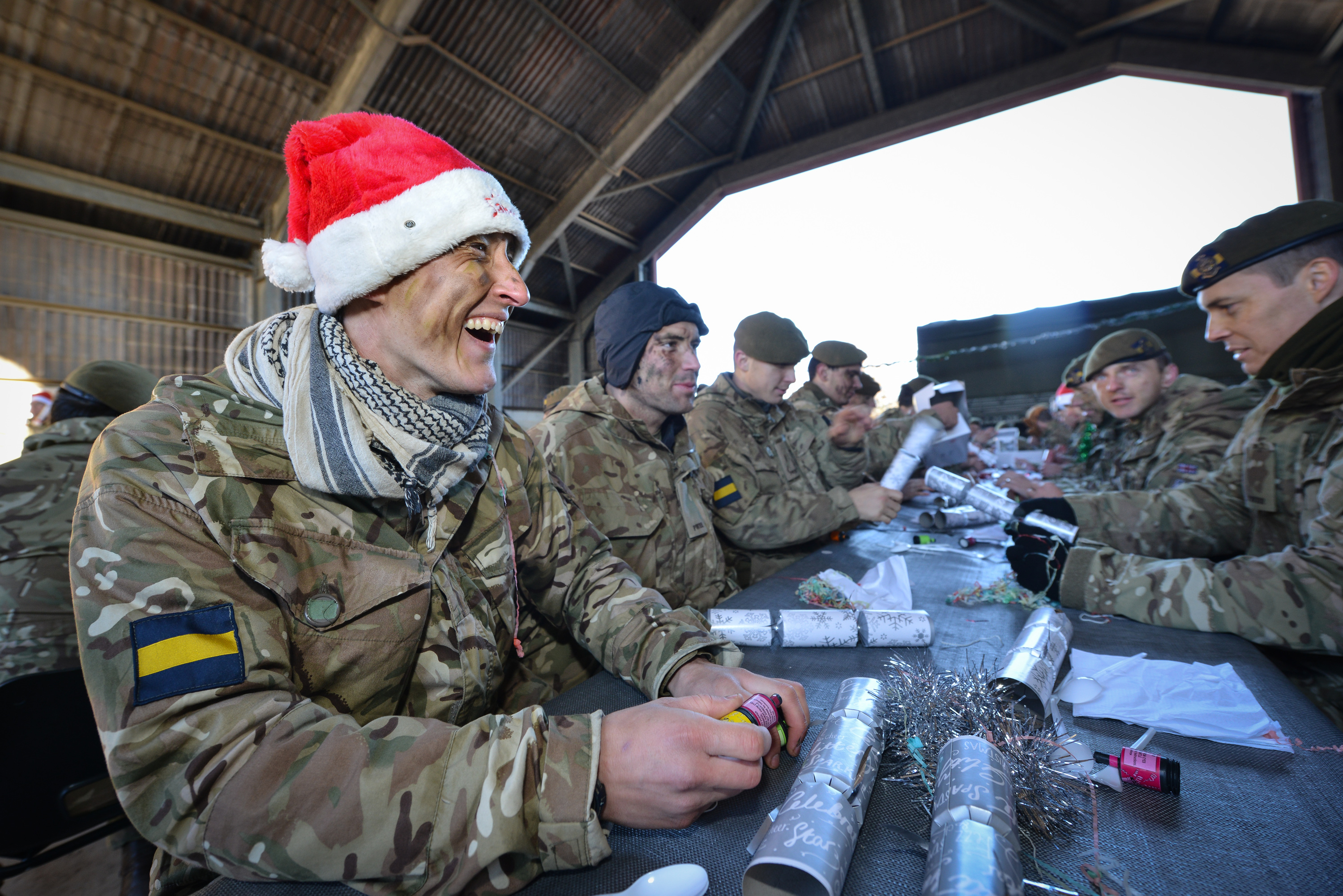 Pictured: Soldiers from 3PWRR about to received their Christmas Lunch from Officers and Senior Non Commissioned Officers.