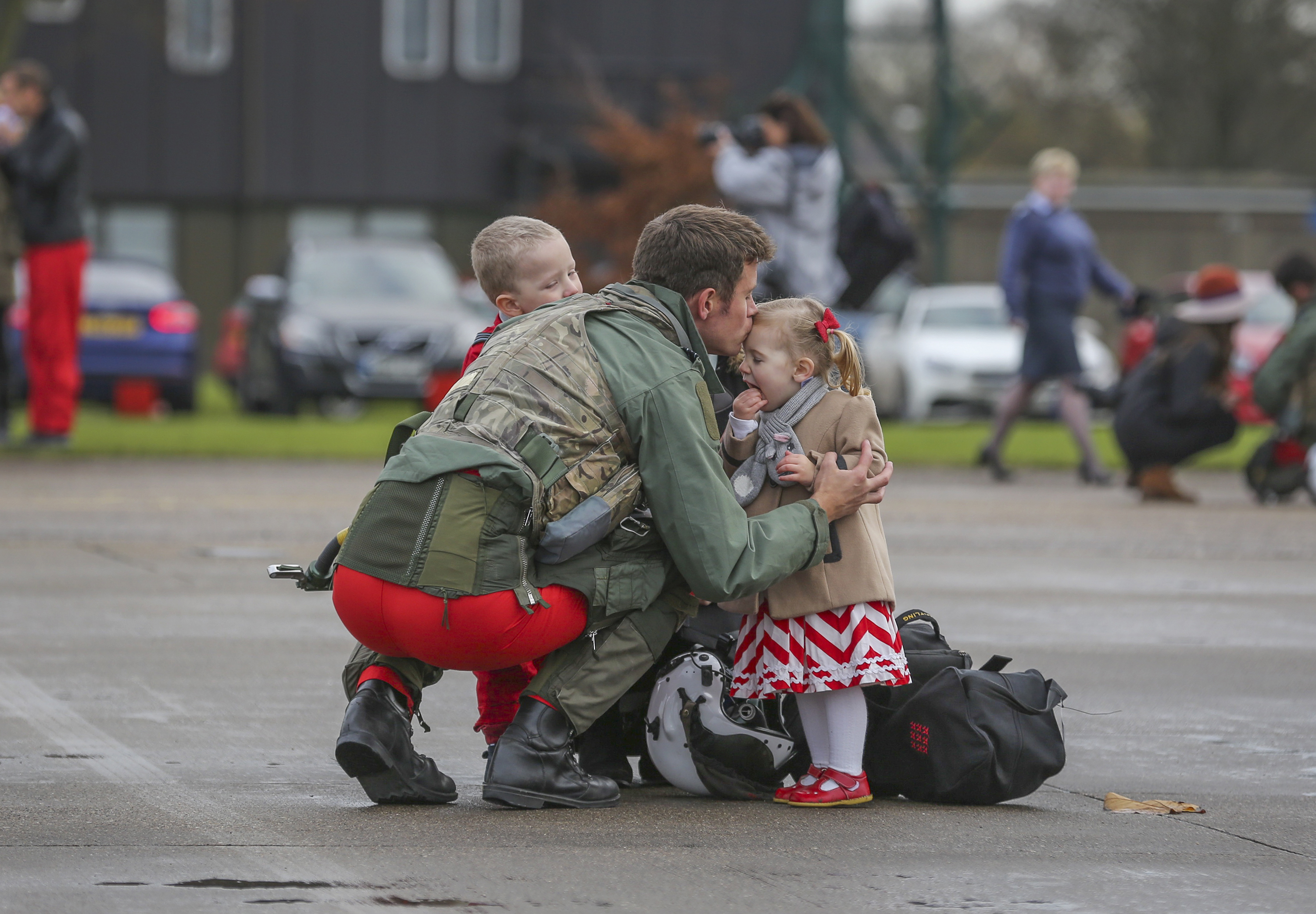 The Red Arrows arrive back at RAF Scampton after their tour of Asia Pacific and the Middle East. Friends and family of the team welcome them home. Flt Lt Tom Bould, Red 7, meets his wife and children after landing.