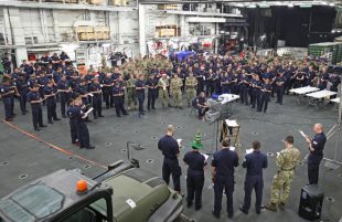 Image of ships company, HMS Ocean singing Christmas carols.