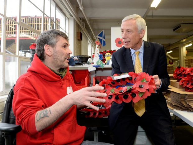 Earl Howe meets Gregg Howell, who makes poppies and wreaths at the Poppy Factory.