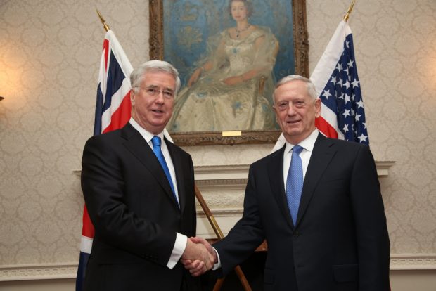 Secretary Sir Michael Fallon shaking hands with US Secretary of Defense Jim Mattis inside the Ministry of Defence.