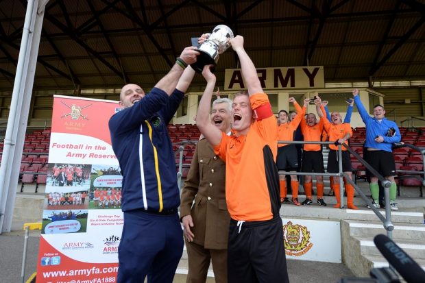 Members of 154 (Scottish) Regiment RLC celebrate winning the Army Reserves Challenge Cup Final on Saturday.