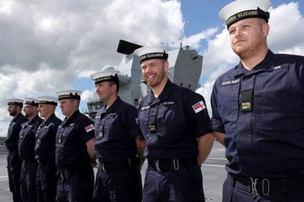 Members of the Air Department from HMS Queen Elizabeth are shown here on her flight deck.