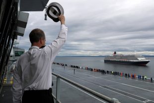 HMS Queen Elizabeth met the Cunard cruise liner MV Queen Elizabeth off the coast of Scotland on 6 July.    HMS Queen Elizabeth is currently undergoing sea trials and was at anchor just off the coast of Invergordon. 