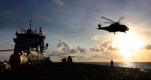 After HMS Ocean's arrival in the Caribbean, Wildcat and Merlin Mk 3 Helicopters from 845 and 847 Naval Air Squadron, of the Commando Helicopter Force (CHF) conduct deck landing and winching practice. Crown copyright.