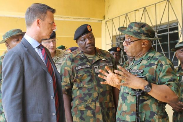 Senior officers from the Nigeria School of Military Engineering brief Mark Lancaster TD MP, on their operations. The minister was visiting UK troops training Nigerian soldiers in bomb scene management and response to terrorist attacks.