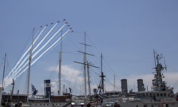 A fly past involving a Hellenic Air Force Mirage jet and nine aircraft from the Royal Air Force Aerobatic Team, the Red Arrows, marked His Royal Highness The Prince of Wales' historic visit to Athens. Crown copyright.