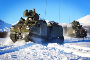 Pictured are Viking Vehicles move through deep snow around Bardufoss exercise areas during Ex Cold Enabler 2018 in Norway.