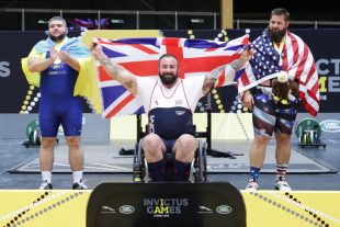 An invictus games powerlifter celebrates winning gold