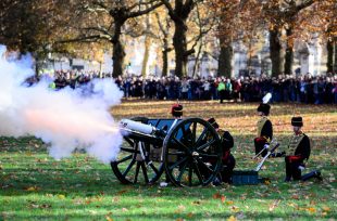 Soldiers fire cannons in a 41 gun salute