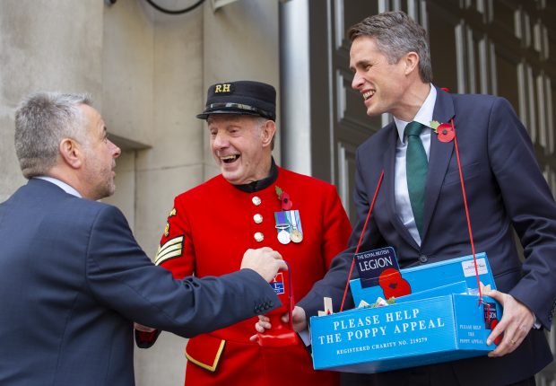 Defence Secretary Gavin Williamson yesterday joined Chelsea Pensioners Anthony Hunt and June Lowe to collect donations for The Royal British Legion’s Poppy Appeal in Westminster. Crown Copyright.