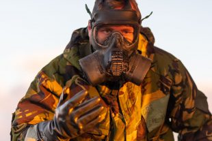 A soldier in CBRN kit