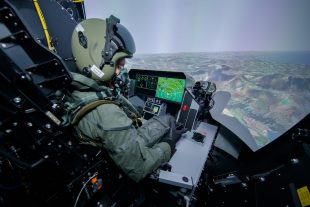 A pilot in a training simulator